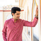 An indian man wearning color kurta 