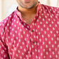 Close-up view of An Indian man wearing pink color short kurta 