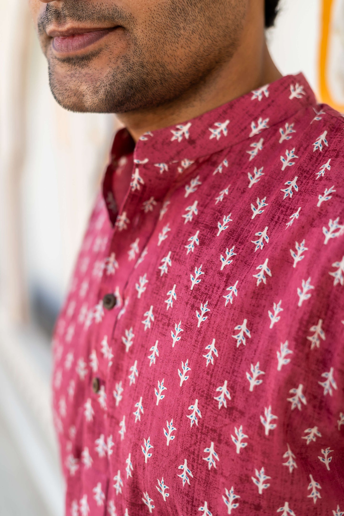 Close-up view of Men's pink short kurta with Floral Print