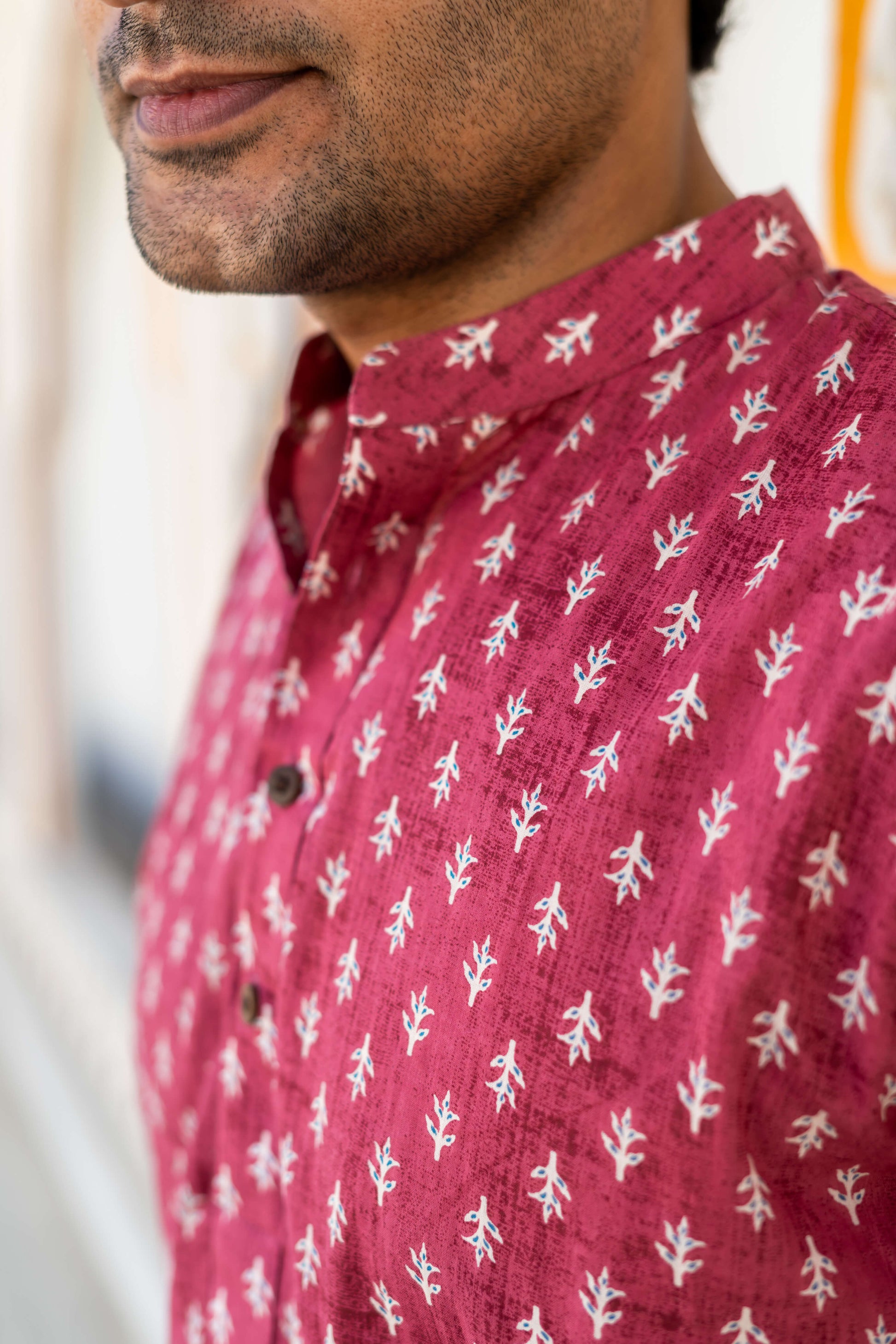 Close-up view of Men's pink short kurta with Floral Print