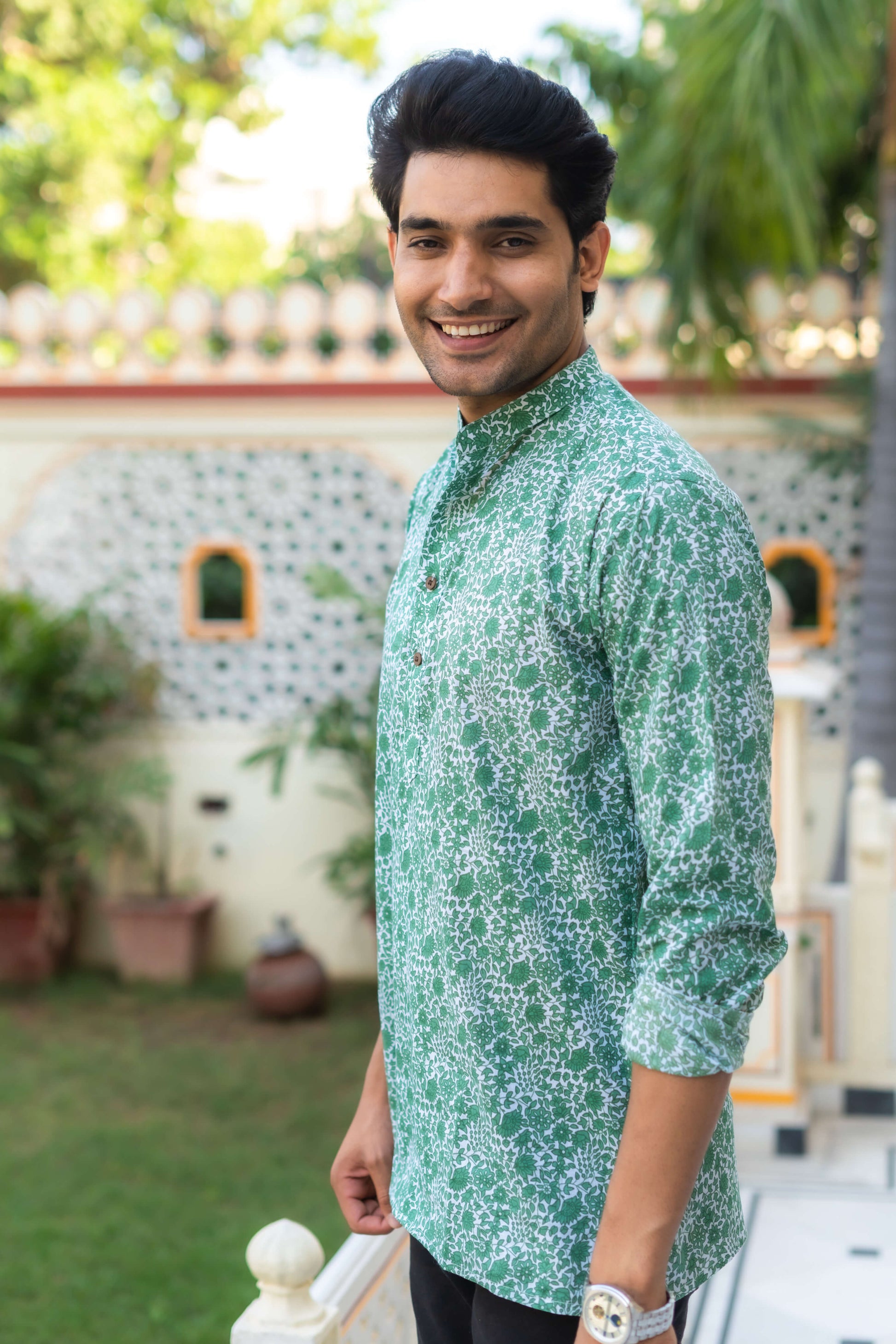 Indian men wearing green short kurta