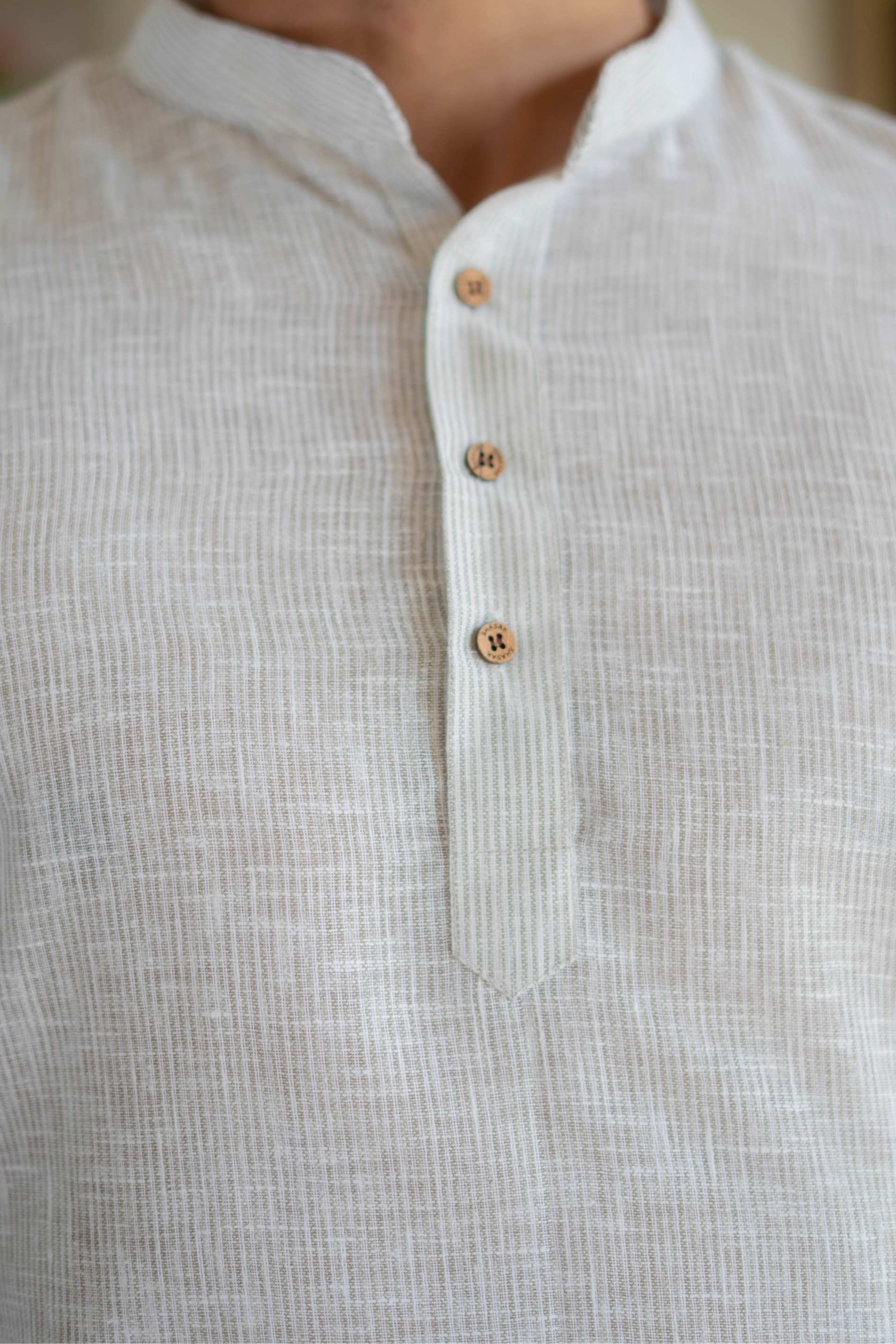 The Off White Yarn Dyed Short Kurta with Blue Weave Design