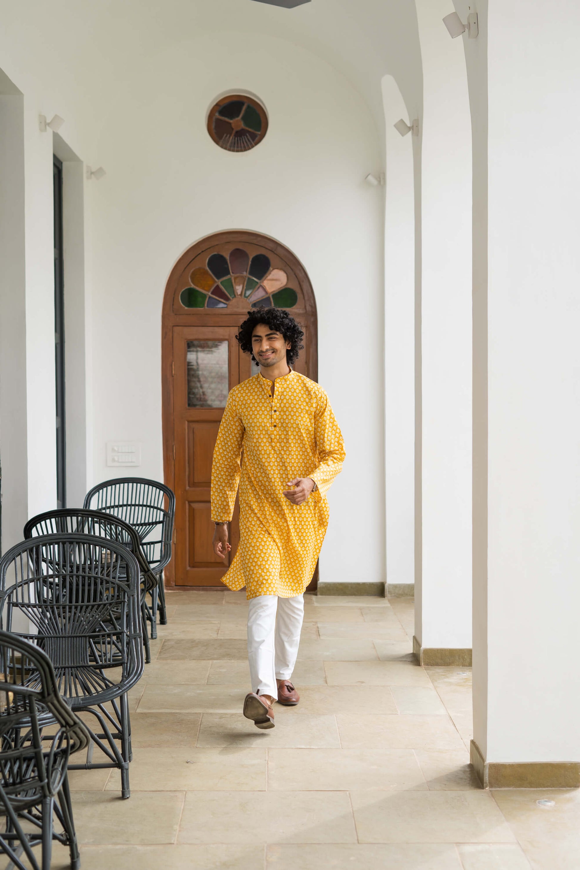 Indian man in yellow long kurta